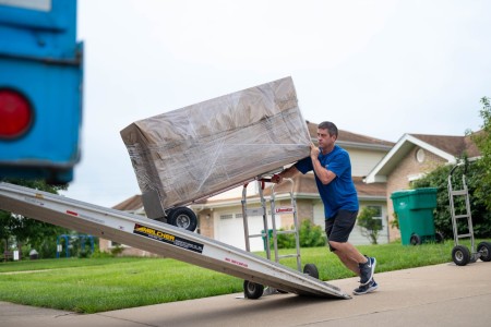 A mover loads boxes into the truck for transport to the next duty station during a Permanent Change of Station on Scott Air Force Base, Illinois, July 18, 2025. The Department of Defense established the Permanent Change of Station Joint Task Force...