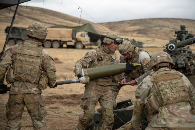 U.S. Army soldiers assigned to Bravo Battery, 1st Battalion, 37th Field Artillery Regiment load a 155mm round during a live-fire exercise at Yakima Training Center, Wash., Wednesday, Nov. 6, 2025. The training enhances artillery crew proficiency...