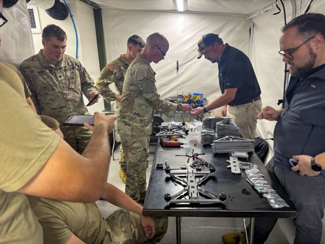 Soldiers assigned to Hunter Army Airfield Innovation Center, 3rd Combat Aviation Brigade, 3rd Infantry Division, Savannah, Ga., work with subject matter experts to assemble drones made from parts that were 3D-printed using the Expeditionary...