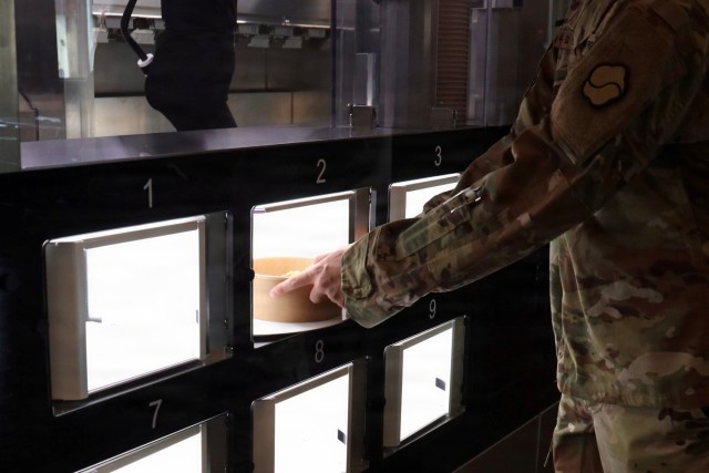 Soldiers retrieves meal from the market19 autonomous kitchen robot