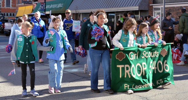 Fort Leavenworth Girl Scouts Troop 5406 members, leaders and families march in the Leavenworth County Veterans Day Parade Nov. 11, 2025, in downtown Leavenworth, Kansas. Photo by Emilio Gutierrez/Fort Leavenworth Lamp Intern