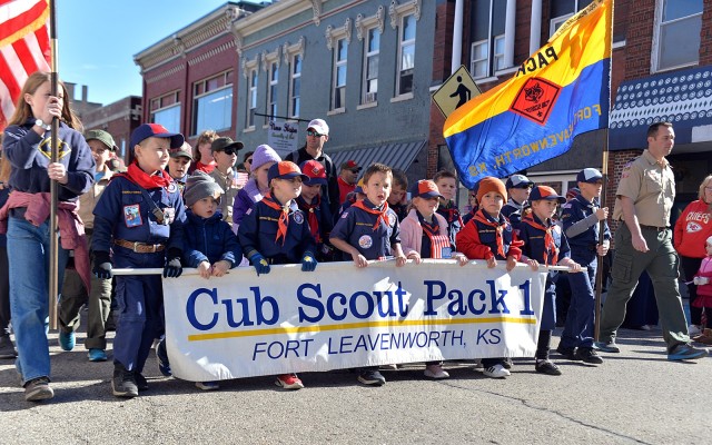 Fort Leavenworth BSA Scouting Cub Scout Pack 1 members, leaders and families march in the Leavenworth County Veterans Day Parade Nov. 11, 2025, in downtown Leavenworth, Kansas. Photo by Emilio Gutierrez/Fort Leavenworth Lamp Intern