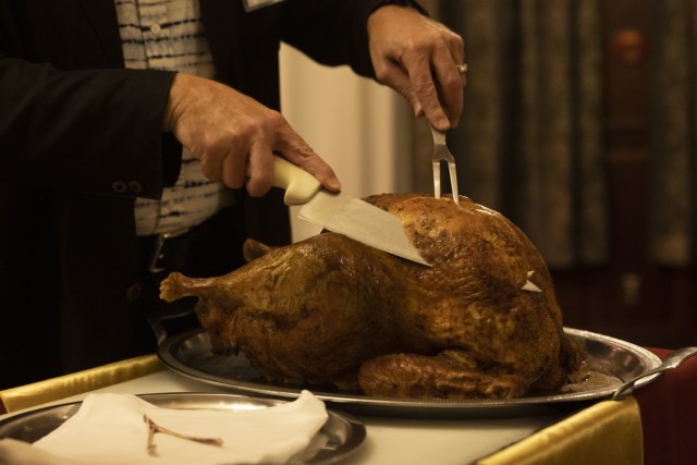 U.S. Marine Corps Maj. Gen. Marcus Annibale, commanding general of 1st Marine Aircraft Wing, carves a turkey during a bilateral Thanksgiving dinner at Butler Officers’ Club, Okinawa, Japan, Nov. 26, 2024. Marines, civilian officials and Japan...