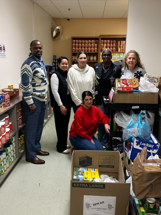 Fort Belvoir Food Pantry employees and food