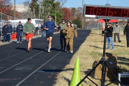 1LT Faust from the 52nd EOD sets a new world record run in a bomb suit with a time of 10 minutes, 19 seconds, at Fort Belvoir's Pullen Field, Nov. 14. She surpassed the last record by four seconds.
