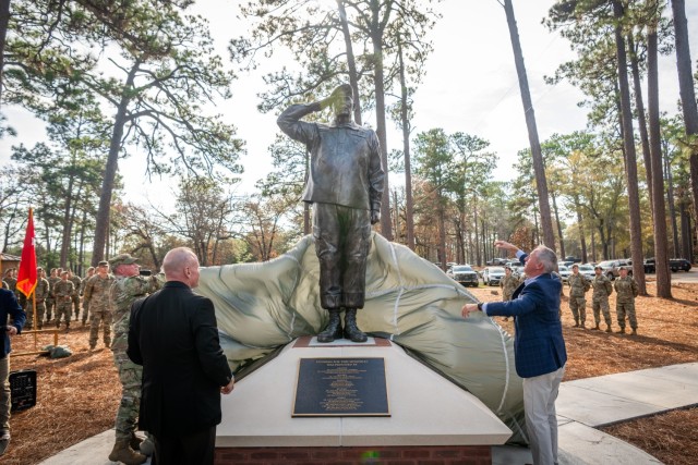 Fort Benning leadership unveils the statue of retired Col. Ralph Puckett Jr., Medal of Honor recipient, during his memorial dedication ceremony at Victory Pond on Fort Benning, Georgia, Nov. 25, 2025. Puckett became an influential figure in the...