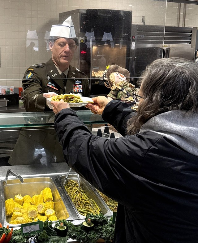 Fort Leavenworth Garrison Commander Col. Todd Sunday helps serve the Thanksgiving meal Nov. 27, 2025, at the Fort Leavenworth (Kansas) Dining Facility. Photo by Sean Bergosh/Fort Leavenworth Garrison Public Affairs Office