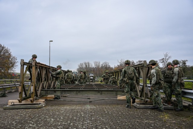 U.S. Army Garrison Benelux and the Dutch Officer Engineer School collaborated at Brunssum, the Netherlands, to construct a Bailey Bridge on Dec. 3, 2025. Built as part of the Dutch military training program, the bridge increases load capacity from...