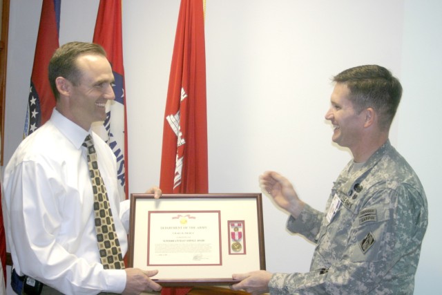 Pierce receiving a Superior Civilian Service Award