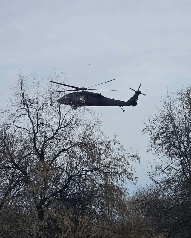 A UH-60M Black Hawk helicopter assigned to the United States Army Air Ambulance Detachment–Yakima, 2nd Battalion, 158th Aviation Regiment, 16th Combat Aviation Brigade, assist in evacuating civilians affected by flooding in Yakima County, Wash.,...