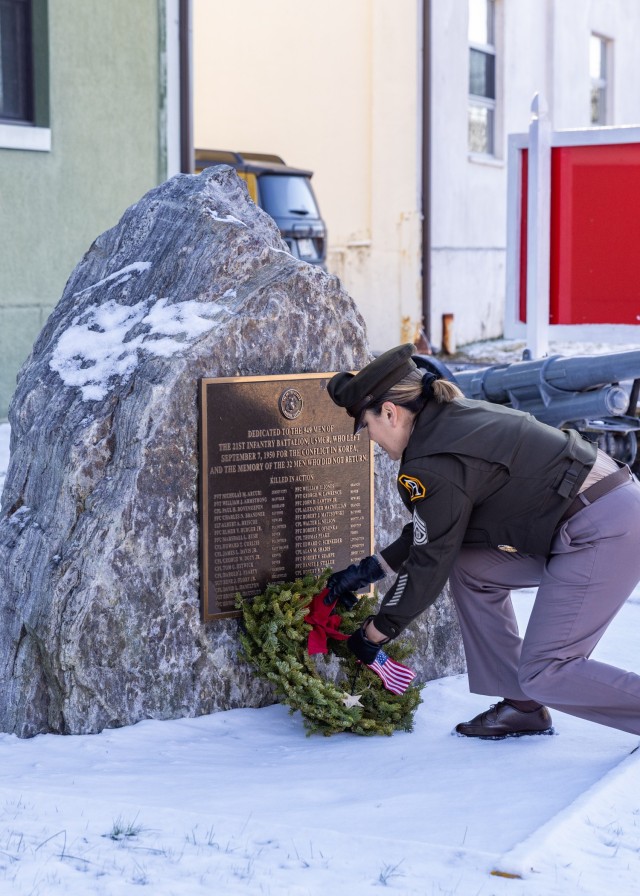 PICATINNY ARSENAL, N.J. - Command Sgt. Maj. Claudia Tapia places a wreath at the base of the Korean War monument dedicated to the 949 men of the U.S. Marine Corps’ 21st Infantry Battalion who left for the conflict in Korea in 1950, and the...