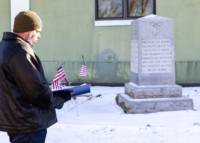 PICATINNY ARSENAL, N.J. - Jason Huggan, Chief, Environmental Affairs Division, U.S. Army Garrison Picatinny Arsenal's Directorate of Public Works, reads a citation at the monument erected in honor the 17 military officers and two women who...