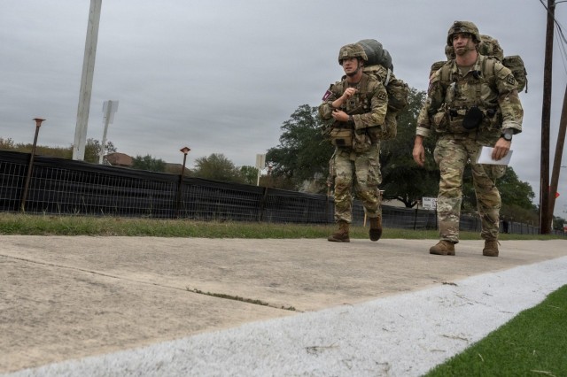U.S. Army Sgt. 1st Class Gregory Gilbert an anatomy and physiology instructor, right, and Capt. Thomas Garcia a Basic Officer Leader Course instructor, with the 187th Medical Battalion, participate in the buddy run portion of the U.S. Army Medical...