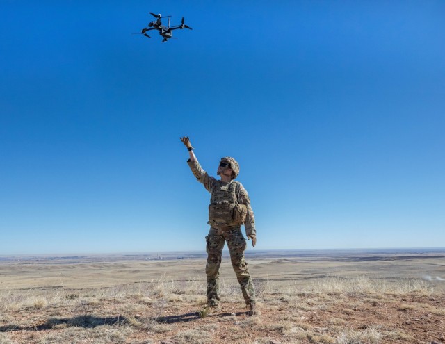 A Soldier assigned to the 2nd Battalion, 77th Field Artillery Regiment, 2nd Stryker Brigade Combat Team, 4th Infantry Division, prepares to receive a landing Small Unmanned Aircraft System (SUAS) after tracking artillery rounds during Exercise...