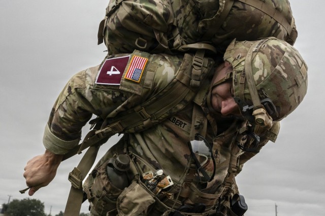 U.S. Army Sgt. 1st Class Gregory Gilbert, 187th Medical Battalion anatomy and physiology instructor, adjusts his ruck pack for the buddy run test during the U.S. Army Medical Center of Excellence Best Medic Competition on Fort Sam Houston, Texas,...