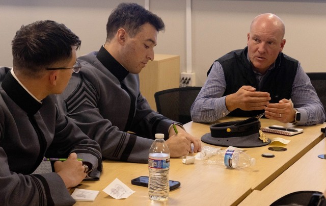 PICATINNY ARSENAL, N.J. - U.S. Army Combat Capabilities Development Command (DEVCOM) Armaments Center engineer Ralph Tillinghast engages in a discussion with a group of U.S. Military Academy cadets during an ideation session about future...