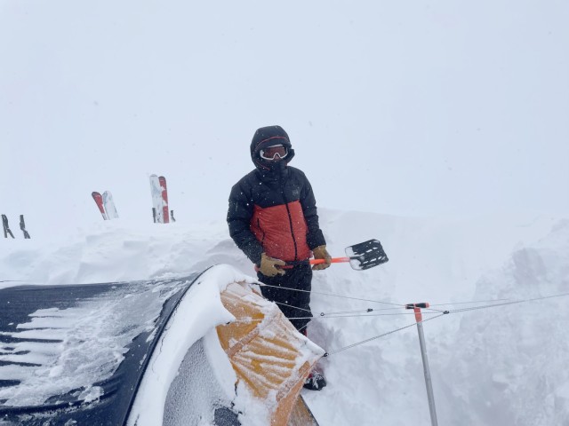 CPT Schindler digs out Camp 2 during the storm at 9,700 feet.