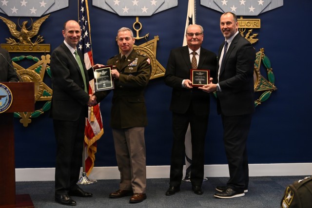 Representatives of the 2nd Theater Signal Brigade and the Community of Wackernheim, Germany receive the Army Community Partnership Award during a ceremony at the Pentagon, Arlington, Virginia, Dec. 9, 2025. The annual ceremony showcases how Army...