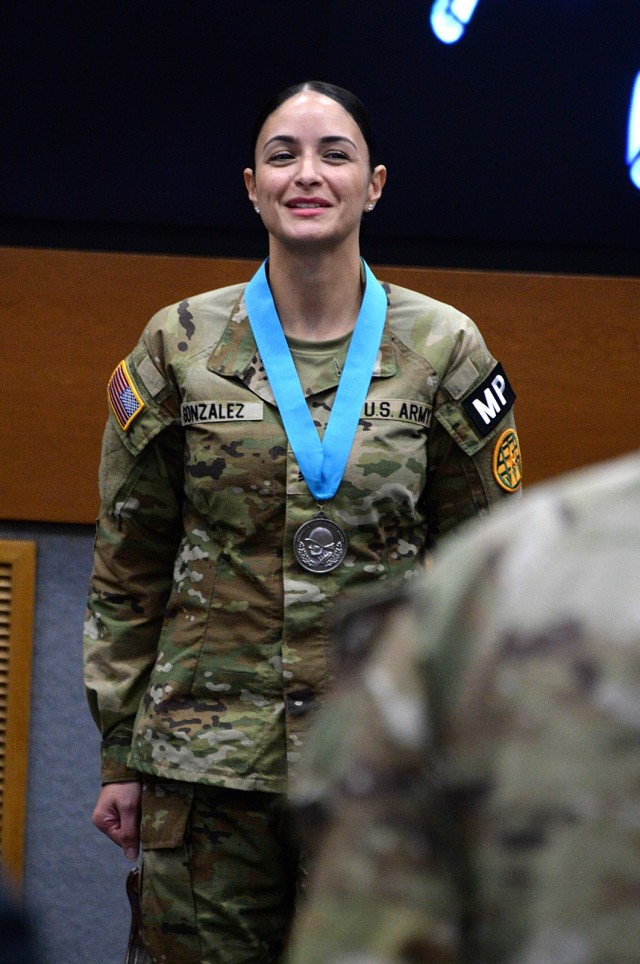 Sgt. Jessica Gonzalez, Headquarters and Headquarters Company, Midwest Joint Regional Correctional Facility Battalion (Corrections), recites the NCO Creed with fellow NCOs during her Sergeant Audie Murphy Club induction ceremony Dec. 11, 2025, in...