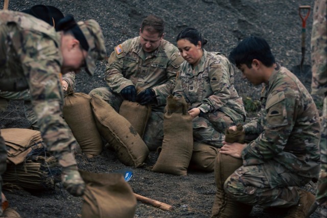 Guard personnel conduct sand bag filling operations in Skagit County