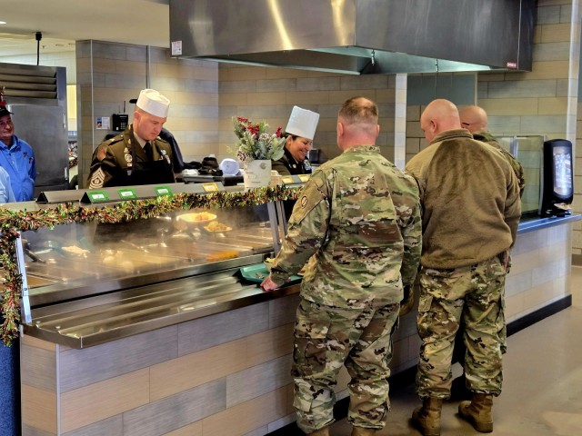 U.S. Army Garrison-Fort McCoy leaders serve guests Dec. 4, 2025, in Dining Facility 1362 during a special holiday meal for installation personnel at Fort McCoy, Wis. More than 150 people took part in the event that coincides with the start of the...