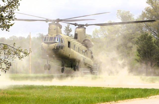 A U.S. Army CH-47 Chinook helicopter and crew with the 7th Battalion, 158th Aviation Regiment of New Century, Kansas, supports an event May 15, 2025, at Big Sandy Lake on South Post at Fort McCoy, Wis., for the 2025 Army Reserve Best Squad...