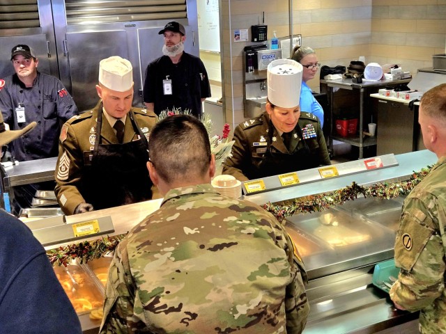U.S. Army Garrison-Fort McCoy leaders serve guests Dec. 4, 2025, in Dining Facility 1362 during a special holiday meal for installation personnel at Fort McCoy, Wis. More than 150 people took part in the event that coincides with the start of the...