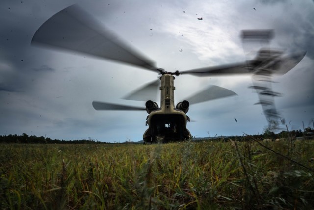 U.S. Army crew members, with Company G, 2nd Battalion, 135th General Support Aviation Battalion, prepare a CH-47 Chinook to transport U.S. Reserve Airmen for a medical transport mission during Exercise Patriot Medic 25 at Fort McCoy, Wis., Aug....