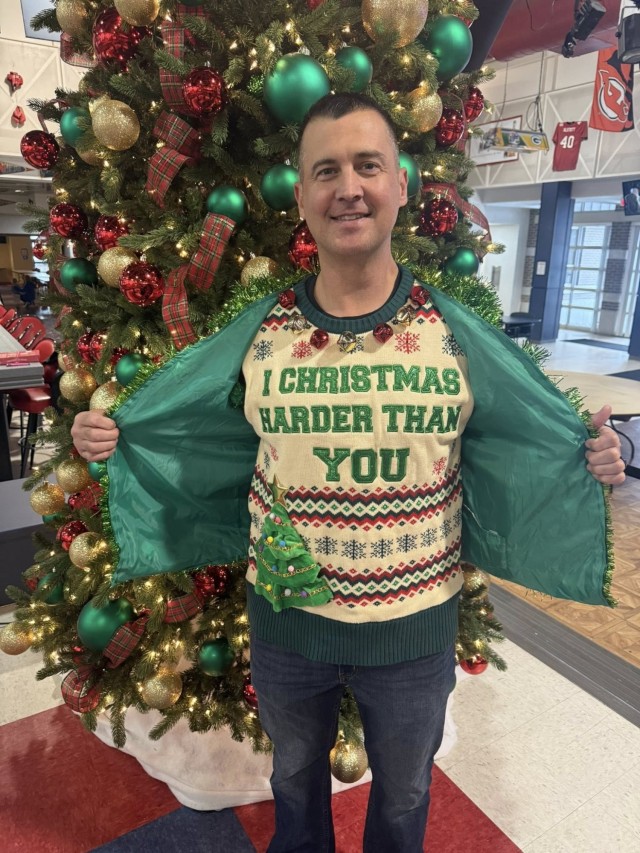 Command Sgt. Maj. James Riddle, Fort McCoy Garrison command sergeant major, displays his wardrobe for the 2025 Breakfast with Santa, Gingerbread House Showdown event Dec. 5, 2025, at Fort McCoy, Wis. Riddle was among dozens of Fort McCoy community...