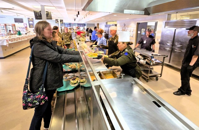 U.S. Army Garrison-Fort McCoy leaders serve guests Dec. 4, 2025, in Dining Facility 1362 during a special holiday meal for installation personnel at Fort McCoy, Wis. More than 150 people took part in the event that coincides with the start of the...