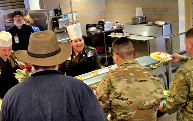 U.S. Army Garrison-Fort McCoy leaders serve guests Dec. 4, 2025, in Dining Facility 1362 during a special holiday meal for installation personnel at Fort McCoy, Wis. More than 150 people took part in the event that coincides with the start of the...