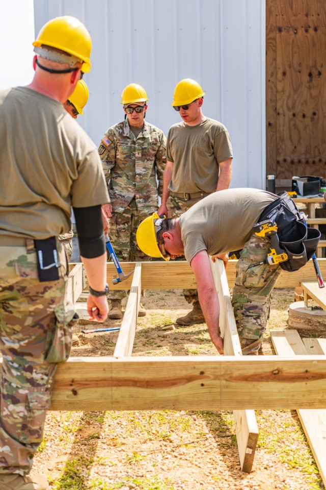 U.S. Army Reserve Soldiers from the 372nd Engineer Company out of Pewaukee, Wis. work on a Troop Project located on EPW site constructing a SWA Hut with four interrogation rooms during their annual training at Fort McCoy, Wis.....