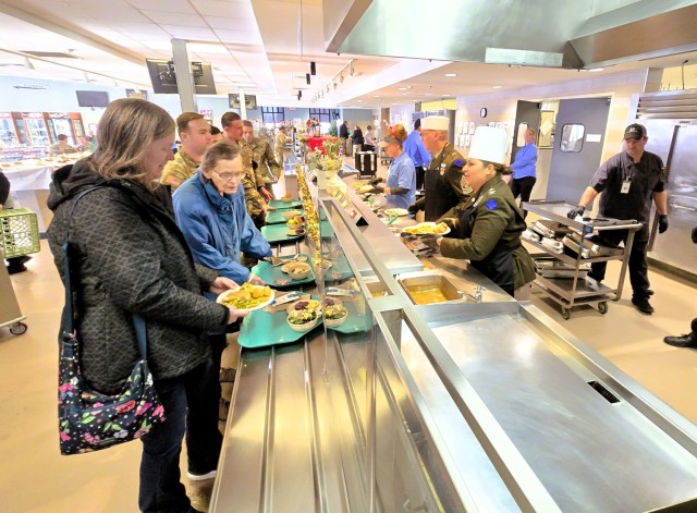 U.S. Army Garrison-Fort McCoy leaders serve guests Dec. 4, 2025, in Dining Facility 1362 during a special holiday meal for installation personnel at Fort McCoy, Wis. More than 150 people took part in the event that coincides with the start of the...