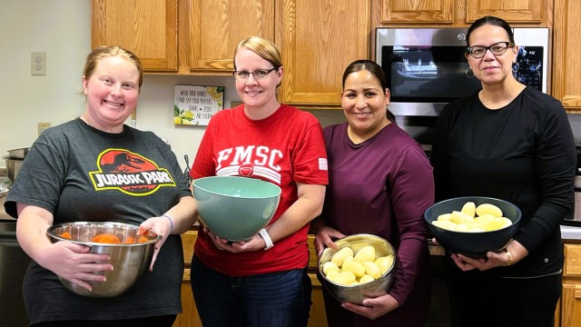 Personnel preparing food for a furlough meal for the installation community are shown Nov. 5, 2025, at the Religious Support Office building at Fort McCoy, Wis. More than 50 meals were prepared for the event. (Contributed photo)