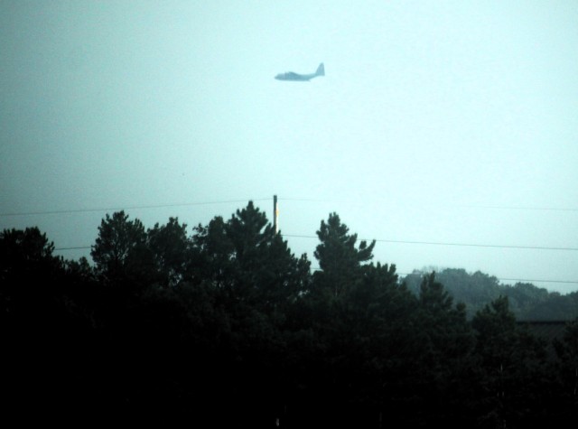 Training operations with a C-130 Hercules flying over South Post are shown July 23, 2025, at Fort McCoy, Wis. During July 2025, thousands of troops trained at Fort McCoy for annual training, weekend training, and institutional training. July is...