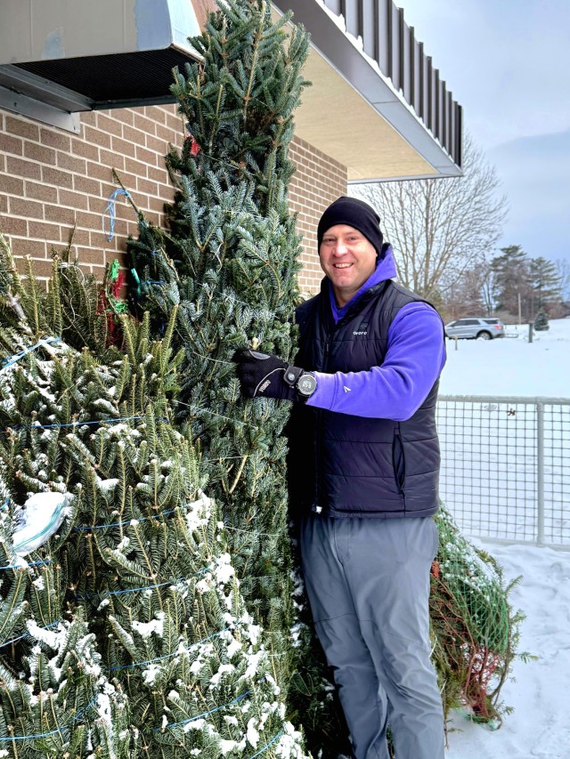 Lt. Col. Michael Zinnecker, 88th Readiness Division, picks out a Christmas tree Dec. 6, 2025, during the Trees for Troops event at Fort McCoy, Wis. According to www.christmasspiritfoundation.org, the Trees for Troops program has provided a total...