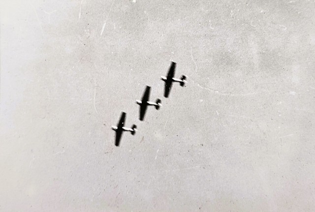 Navy warplanes fly in formation during an aerial demonstration in 1944 at Camp McCoy, Wis. During World War II, McCoy expanded its training space to include tens of thousands of acres of training area. During the war, the post trained tens of...