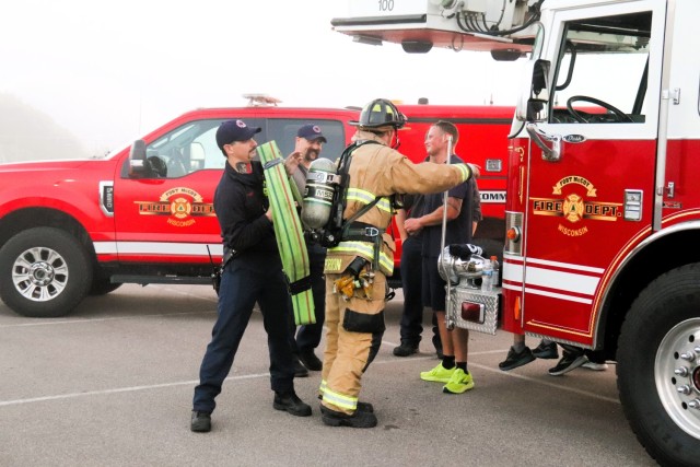 A firefighter with the Fort McCoy Directorate of Emergency Services Fire Department, Brandon Perron, participates in a 9/11 Memorial Run & Stair Climb hosted on Fort McCoy, Wis., on Sept. 11, 2025. The run is in honor of 2,975 civilians, Soldiers,...