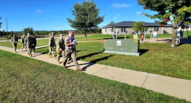 Members of the U.S. Army Garrison-Fort McCoy command staff and other garrison members participate in a “walking town hall” event Sept. 24, 2025, at Fort McCoy, Wis. The town hall allowed for Fort McCoy leaders to meet directly with...