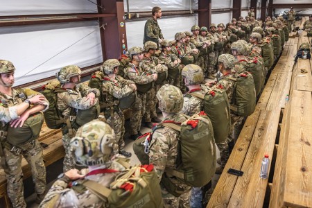 Paratroopers from five nations leap into holiday tradition at Fort