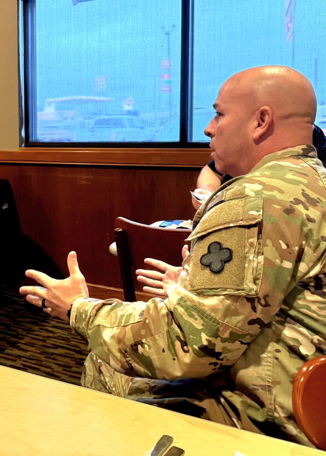 Fort McCoy Garrison Deputy Commander Lt. Col. Chad Holder talks with members of the Tomah Chamber of Commerce in Tomah, Wis., during a chamber meeting Nov. 19, 2025. Holder and other Fort McCoy members engaged with the group during their monthly...