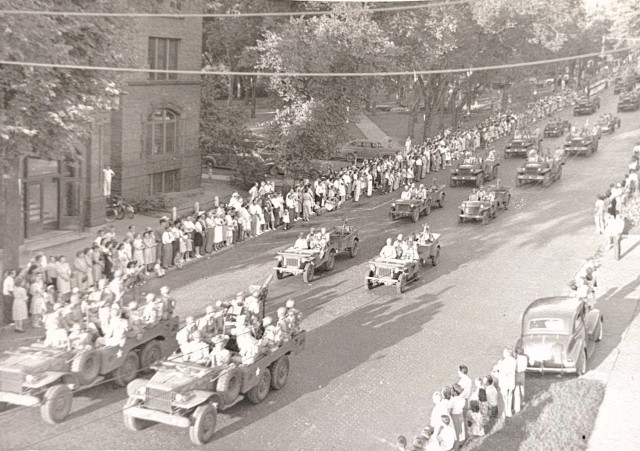 Soldiers from then-Camp McCoy, Wis., participate in a parade for War Salvage Day in 1943 in La Crosse, Wis. Local history also describes how La Crosse participated in national “Salvage for Victory” campaigns during 1943, with specific...