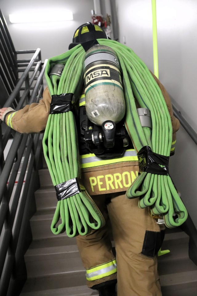 A firefighter with the Fort McCoy Directorate of Emergency Services Fire Department, Brandon Perron, participates in a 9/11 Memorial Run & Stair Climb hosted on Fort McCoy, Wis., on Sept. 11, 2025. The run is in honor of 2,975 civilians, Soldiers,...