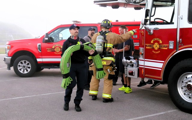 A firefighter with the Fort McCoy Directorate of Emergency Services Fire Department, Brandon Perron, participates in a 9/11 Memorial Run & Stair Climb hosted on Fort McCoy, Wis., on Sept. 11, 2025. The run is in honor of 2,975 civilians, Soldiers,...