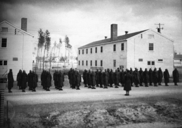 100th Infantry Battalion Soldiers are shown in formation outside barracks at Camp McCoy, Wis., in 1942. The 100th was one of the most decorated units during World War II.  (100th Infantry Battalion courtesy photo)