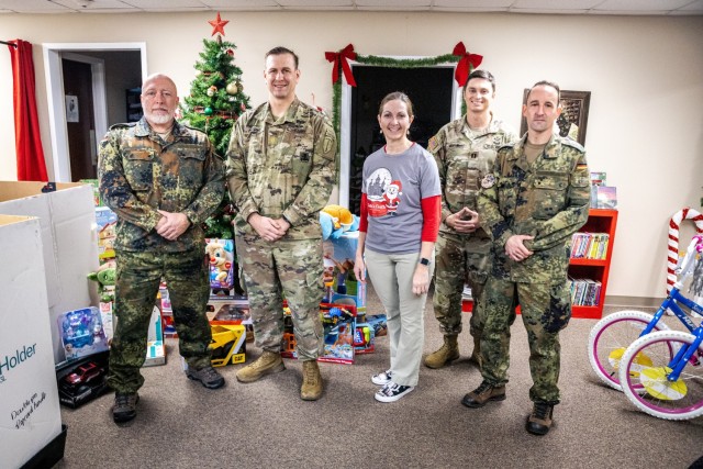 U.S. Army Soldiers with the 1st Battalion, 507th Parachute Infantry Regiment, and German paratroopers deliver toys to Santa’s Castle at Fort Benning, Georgia, Dec. 18, 2025. The items were collected during the 2025 Operation Toy Drop, a combined...