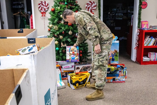 A U.S. Army Soldier with the 1st Battalion, 507th Parachute Infantry Regiment, assists in delivering toys collected during Operation Toy Drop to Santa’s Castle at Fort Benning, Georgia, Dec. 18, 2025. More than 500 toys were donated during the...