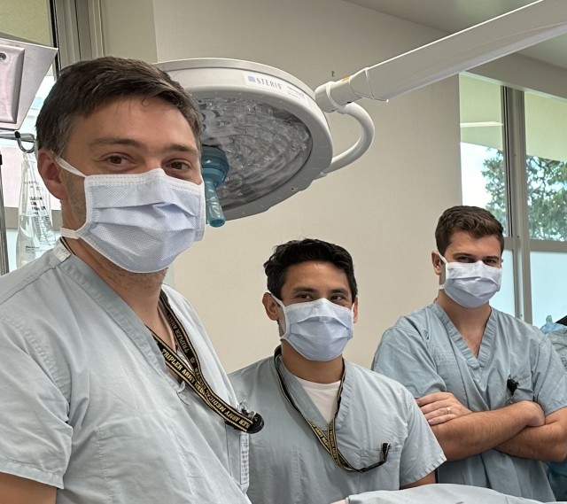 Tripler Army Medical Center General Surgery Residents, U.S. Army Capt. Cameron Harvey, U.S. Army Capt. Obeth Bahena Gutierrez, and U.S. Army Capt. Bradley Pierce pose for a picture at Tripler Army Medical Center during ECMO life support research...