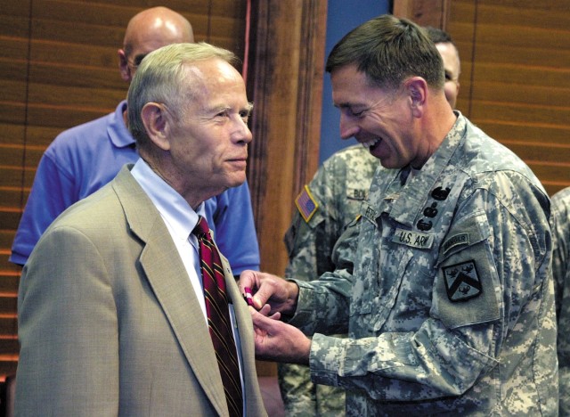 Combined Arms Center and Fort Leavenworth Commander Lt. Gen. David Petraeus pins Jack Walker with the Superior Civilian Service Award before a meeting in the CAC commander's conference room Aug. 25, 2006, at Fort Leavenworth, Kansas. The Superior...