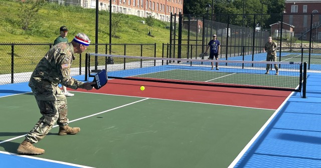 Former Fort Leavenworth Garrison Commander Col. Duane Mosier and his spouse Mandy Mosier take on former Garrison Command Sgt. Maj. Vanessa Sun and her spouse Jimmy Sun in an inaugural pickleball game following a ribbon-cutting ceremony for the new...